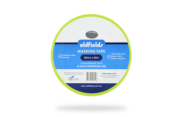 Spool of oldfields masking tape on a green background