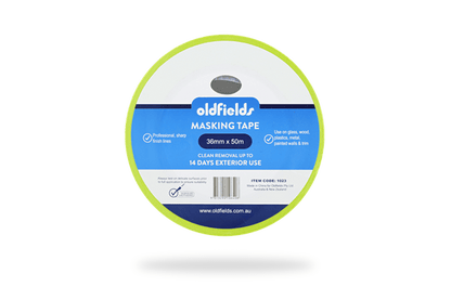 Spool of oldfields masking tape on a green background