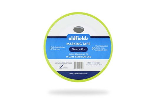 Spool of oldfields masking tape on a green background